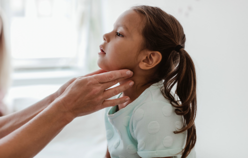 Child being examined by physician