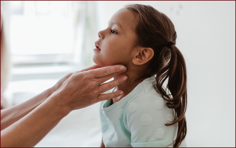 Child being examined by physician
